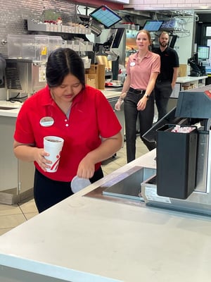 Chon-chon preparing a drink at work at Chick-fil-a.