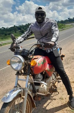 Peter uganda monitor on bike-1