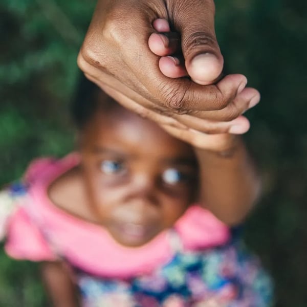 africa_girl_holding_hand-1