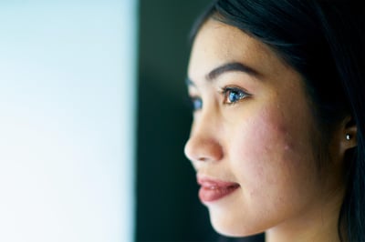 Close up of side profile Asian girl looking out