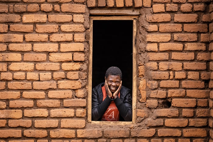 Girl smiling looking out of window