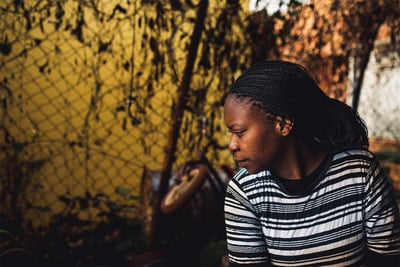 African girl looking down