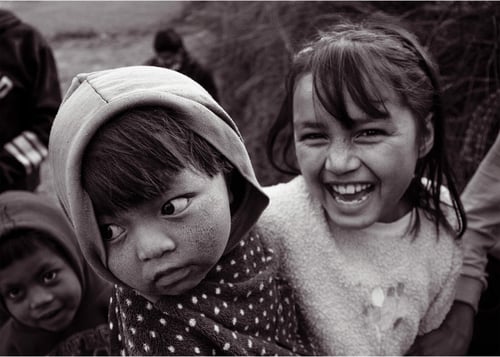 black and white image of children smiling