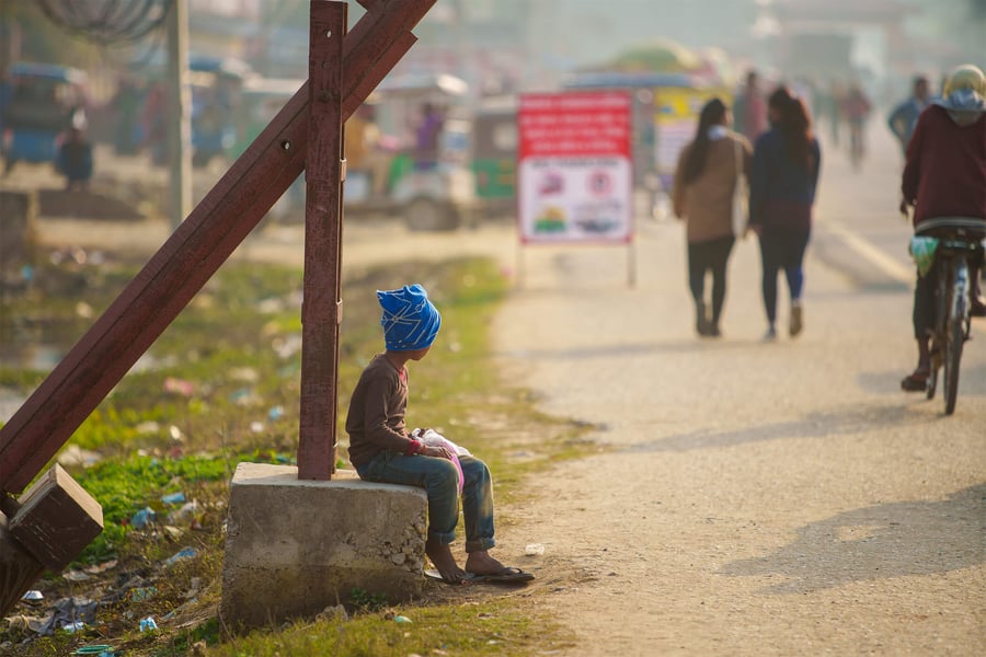boy-sitting-on-street-2