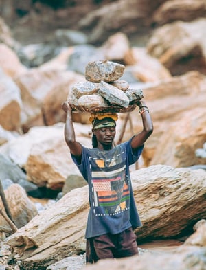 man-carrying-stones-mine-pexels-2