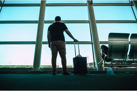 man-standing-at-airport-pexels