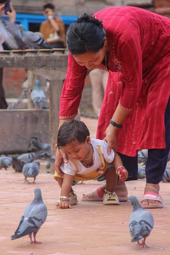 Mother helping child