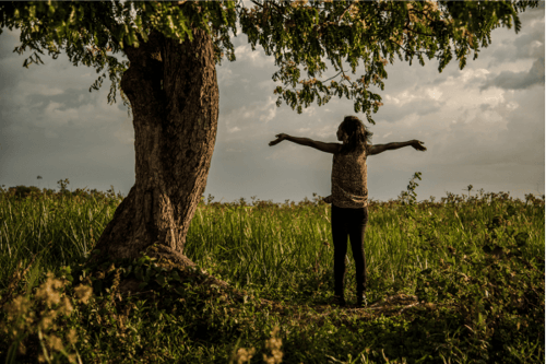 woman with hands outstretched