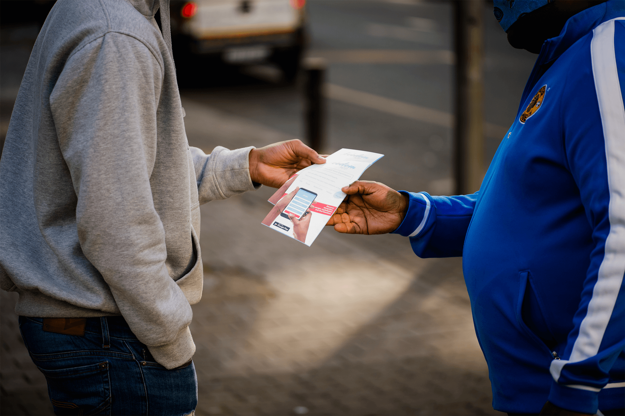 handing out flyer on human trafficking for the freedom project